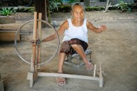Hilltribe woman spinning cotton